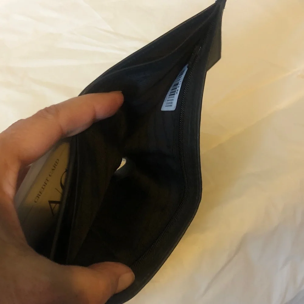 Buttery black leather men’s wallet with zip billfold compartment; new & quality